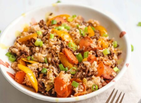 A bowl of cajun beef with veggies and rice