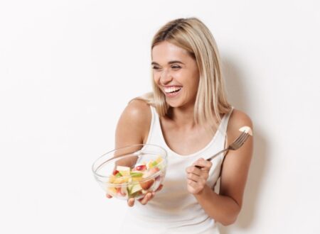 Woman eating a healthy bowl of salad