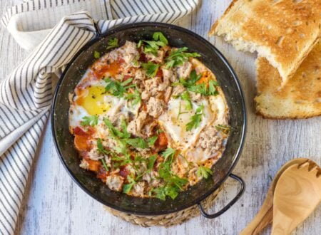 Egg fried on tomato with tuna