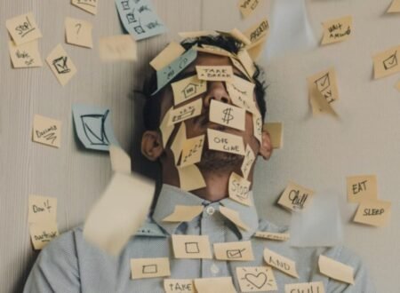 Man with sticker notes form all the tasks and running of his brain