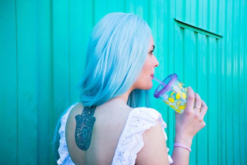 Woman drinking a sugary beverage