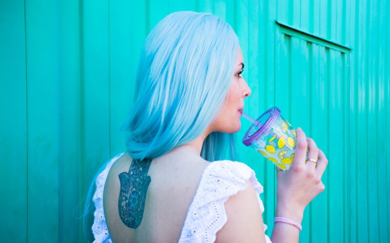 Woman drinking a sugary beverage