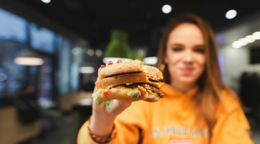 Woman holding burger