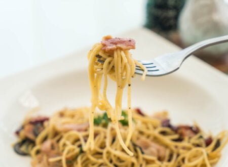 Spaghetti on fork with bacon