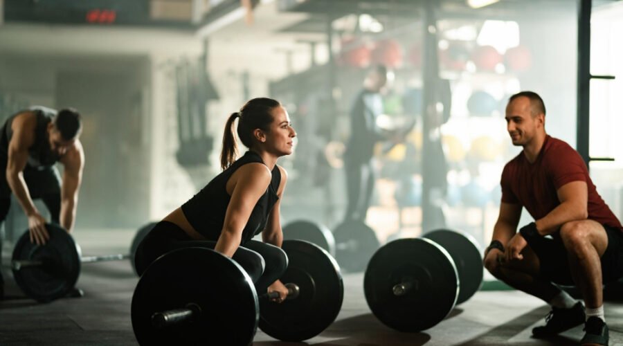 Woman lifting heavy bar