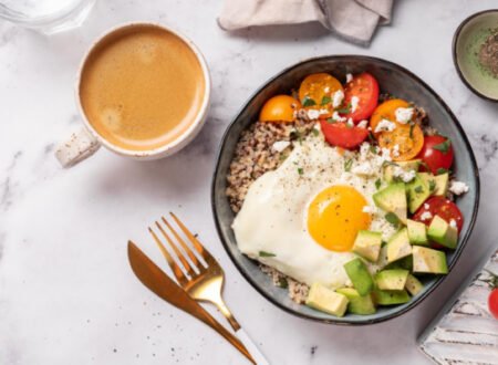 Healthy breakfast meal of avocado, quinoa and egg with a coffee