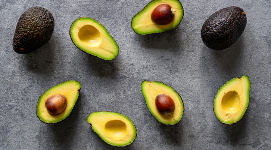 Sliced avocado on a grey surface
