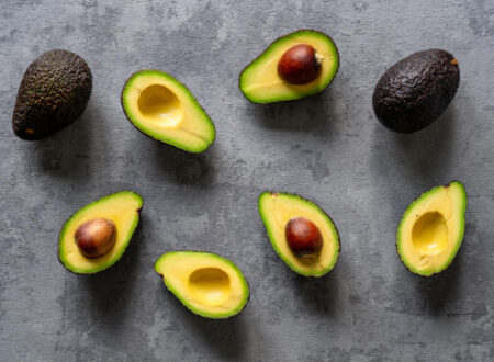 Sliced avocado on a grey surface