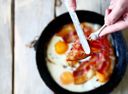 Egg and bacon fried in a pan