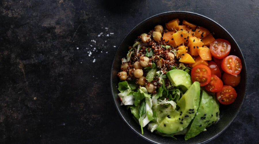 A healthy bowl of vegetables with avocado and quinoa