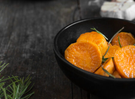 Cooked and sliced sweet potato in a black bowl