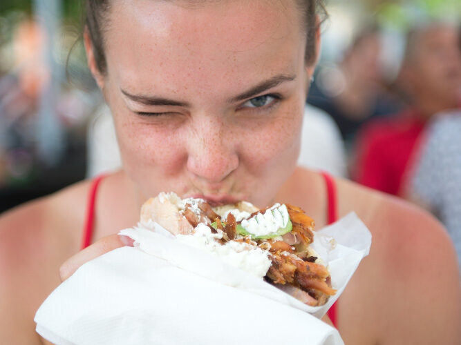 Woman digging into her favourite meal