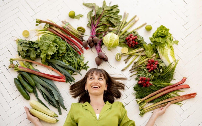 Woman with an array of vegetables
