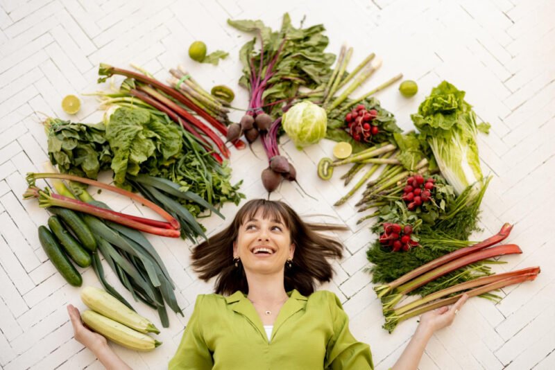 Woman with an array of vegetables