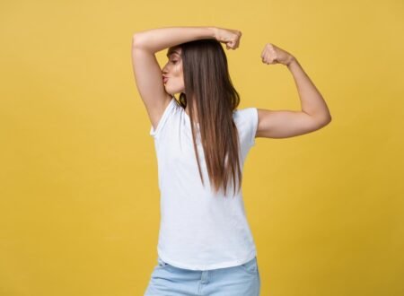 Image of woman kissing her biceps
