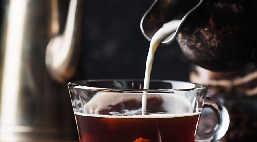 Black tea with milk poured