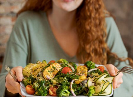 Woman eating an abundant plate of veggies