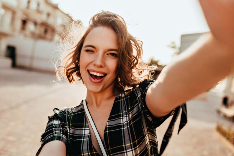 Woman posing for a selfie happy