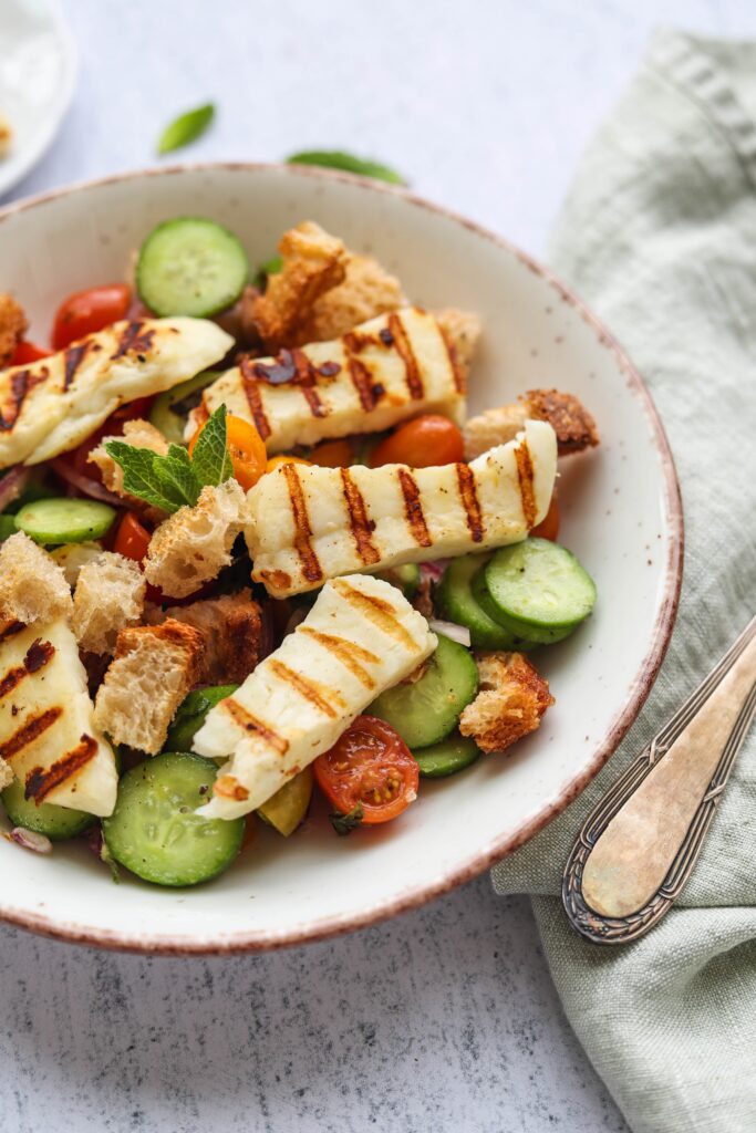 Grilled Halloumi and tomatoes in a bowl