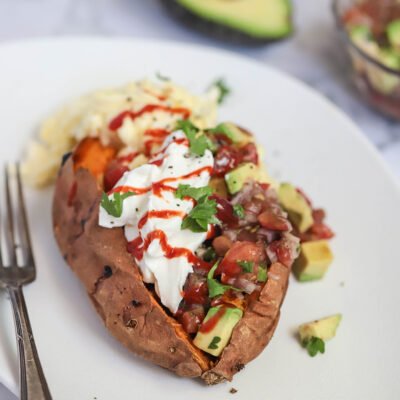 Loaded sweet potato on a plate for eating